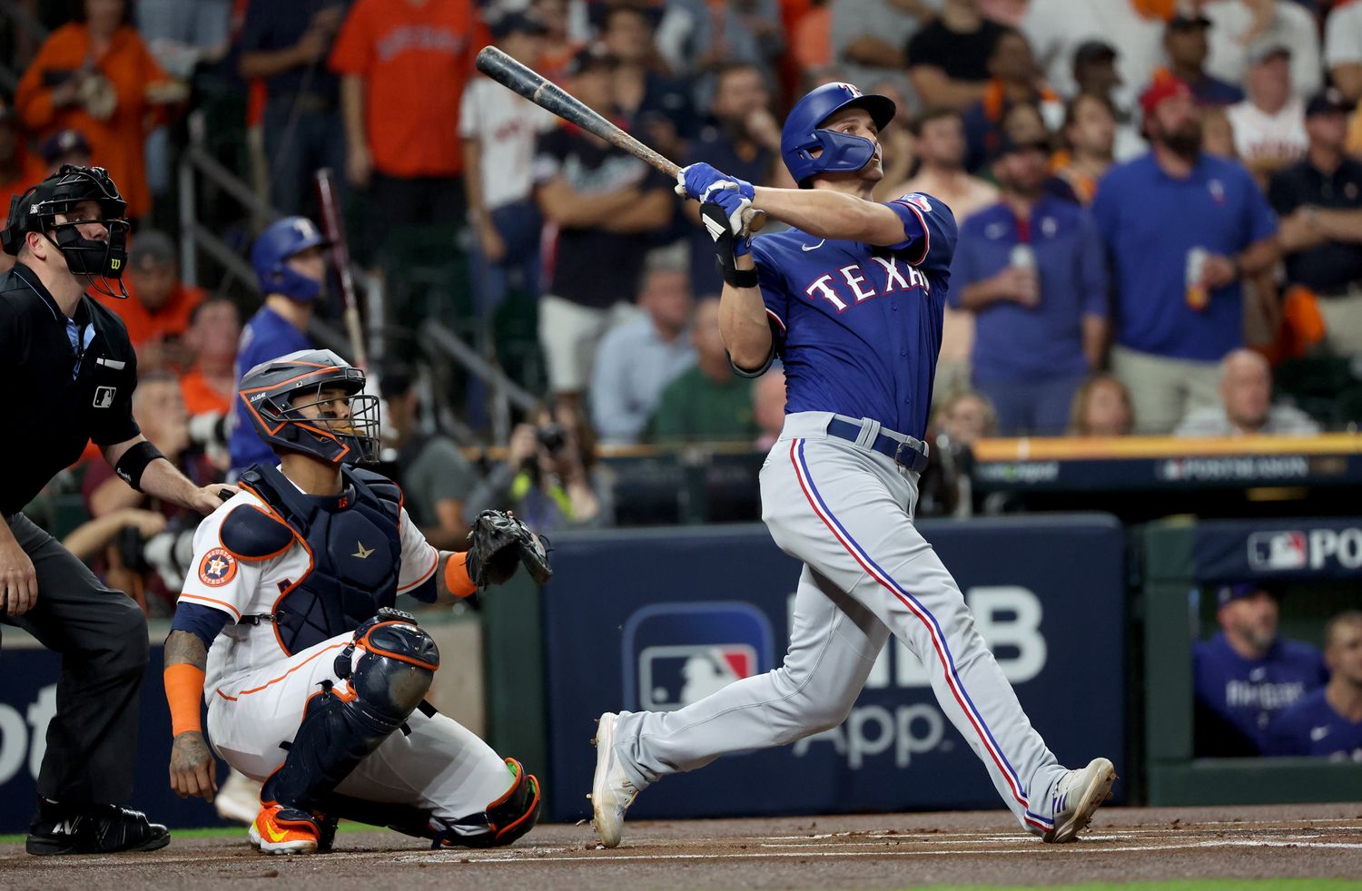 Texas Rangers shortstop Corey Seager hits a home run during the first inning of Game 7 of the ALCS against the Houston Astros at Minute Maid Park.